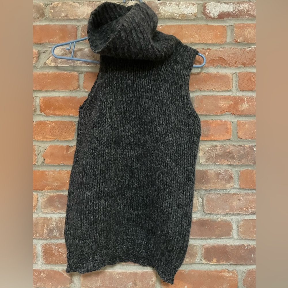 J Crew turtleneck sleeveless sweater.